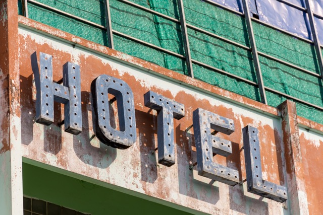 Neon Sign on Hotel that Needs to be Repaired